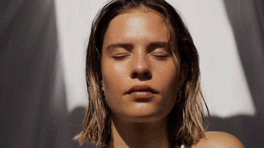 woman with glowing skin in the sun